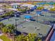 Tennis courts with players enjoying a sunny day at 25917 Bimini Sands Ct, Englewood, FL 34223