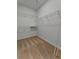 Spacious walk-in closet with wire shelving at 25917 Bimini Sands Ct, Englewood, FL 34223