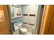 Clean bathroom with a toilet, sink, and large linen closet at 289 Bainbridge Dr, Nokomis, FL 34275