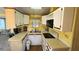 Functional kitchen featuring white cabinets and modern appliances at 289 Bainbridge Dr, Nokomis, FL 34275