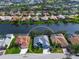 Aerial view of a single-Gathering home with a lake view in a residential community at 2905 Seasons Blvd, Sarasota, FL 34240