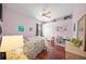 Cozy bedroom with hardwood floors and built-in shelving at 2905 Seasons Blvd, Sarasota, FL 34240