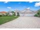 Single-Gathering home with three-car garage and manicured lawn at 2905 Seasons Blvd, Sarasota, FL 34240