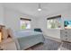 Bright bedroom with a queen bed and TV at 306 66Th St, Holmes Beach, FL 34217