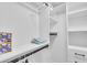 Large walk-in closet with shelving and hanging rods at 306 66Th St, Holmes Beach, FL 34217