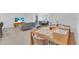 Bright dining area with wood table and seating for four at 306 66Th St, Holmes Beach, FL 34217