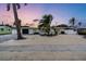 Charming mid-century modern home with a landscaped front yard at 306 66Th St, Holmes Beach, FL 34217
