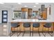 Modern kitchen with island and breakfast bar seating at 306 66Th St, Holmes Beach, FL 34217