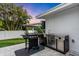 Outdoor kitchen with grill and stainless steel appliances at 306 66Th St, Holmes Beach, FL 34217