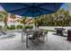 Outdoor patio with table, chairs, and umbrella at 306 66Th St, Holmes Beach, FL 34217