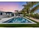 Relaxing pool area with patio furniture and lush landscaping at 306 66Th St, Holmes Beach, FL 34217