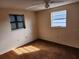 Well-lit bedroom with two windows and carpet at 3286 Terita Dr, Port Charlotte, FL 33952