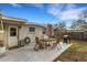 Patio area with table, chairs, and umbrella at 3634 Lokai Pl, Sarasota, FL 34232