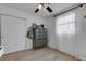 Bedroom with a gray dresser, large closet doors and a bright window with bright natural light at 3634 Lokai Pl, Sarasota, FL 34232