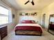 Bedroom with neutral decor and large window at 3878 Deberry Dr, Sarasota, FL 34233