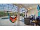 Enclosed patio overlooking the pool, complete with a hammock at 3907 Bayside Dr, Bradenton, FL 34210