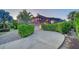 House exterior showcasing a circular driveway and lush landscaping at 3907 Bayside Dr, Bradenton, FL 34210