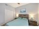 Comfortable bedroom featuring wood-look floors and plenty of closet space at 4228 Central Sarasota Pkwy # 1013, Sarasota, FL 34238