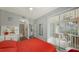 Bedroom with red bedding, private balcony, and en-suite bathroom at 4228 Central Sarasota Pkwy # 1013, Sarasota, FL 34238