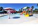 Community pool with water features and slides at 4228 Central Sarasota Pkwy # 1013, Sarasota, FL 34238