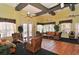 Spacious community room with wicker furniture and tiled floors at 4228 Central Sarasota Pkwy # 1013, Sarasota, FL 34238
