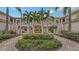 Community courtyard with fountain and lush landscaping at 4228 Central Sarasota Pkwy # 1013, Sarasota, FL 34238