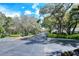 Gated entrance to the community with landscaping at 4228 Central Sarasota Pkwy # 1013, Sarasota, FL 34238
