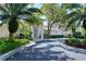 Community clubhouse with lush landscaping and convenient parking at 4228 Central Sarasota Pkwy # 1013, Sarasota, FL 34238