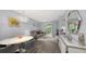 Open living area with dining space and patio access at 4228 Central Sarasota Pkwy # 1013, Sarasota, FL 34238