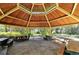 Wooden park pavilion with multiple picnic tables at 4228 Central Sarasota Pkwy # 1013, Sarasota, FL 34238
