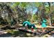 Play area featuring unique dinosaur-themed climbing structures at 4228 Central Sarasota Pkwy # 1013, Sarasota, FL 34238