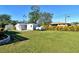 Large backyard with sheds and grassy lawn at 4284 Watova Ave, North Port, FL 34286