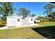Backyard with two sheds and grassy lawn at 4284 Watova Ave, North Port, FL 34286