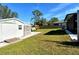 Backyard view with shed and grassy area at 4284 Watova Ave, North Port, FL 34286