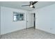 Spacious bedroom with ceiling fan and tile floors at 4284 Watova Ave, North Port, FL 34286