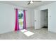 Bedroom with tile floors, ceiling fan, and door to exterior at 4284 Watova Ave, North Port, FL 34286