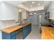 Modern kitchen with white cabinets and butcher block countertops at 4284 Watova Ave, North Port, FL 34286