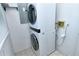 Laundry room with stackable washer and dryer at 4284 Watova Ave, North Port, FL 34286