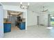 Open concept living room and kitchen with tile floors at 4284 Watova Ave, North Port, FL 34286