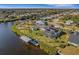 Single-story home with solar panels, pool, dock, and canal views at 4430 Wynkoop Cir, Port Charlotte, FL 33948