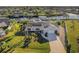 Single-story home with solar panels, lush landscaping, and canal access at 4430 Wynkoop Cir, Port Charlotte, FL 33948
