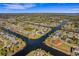 Wide aerial showcasing property location within a waterfront community at 4430 Wynkoop Cir, Port Charlotte, FL 33948