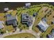 Bird's-eye view of a waterfront property with canal and neighborhood views at 4430 Wynkoop Cir, Port Charlotte, FL 33948
