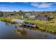 Aerial view of waterfront home with private dock and pool at 4430 Wynkoop Cir, Port Charlotte, FL 33948