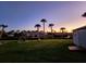 Spacious backyard with lush lawn and canal views at 4430 Wynkoop Cir, Port Charlotte, FL 33948
