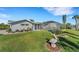 Landscaped backyard with pool and pelican statue at 4430 Wynkoop Cir, Port Charlotte, FL 33948