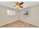 Spacious bedroom with ceiling fan and two windows at 4430 Wynkoop Cir, Port Charlotte, FL 33948