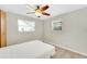 Bedroom with ceiling fan, wood-look flooring, and window at 4430 Wynkoop Cir, Port Charlotte, FL 33948