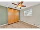 Bedroom with ceiling fan, built-in wardrobe, and wood flooring at 4430 Wynkoop Cir, Port Charlotte, FL 33948