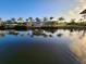 Tranquil canal view showcasing a peaceful waterfront property at 4430 Wynkoop Cir, Port Charlotte, FL 33948
